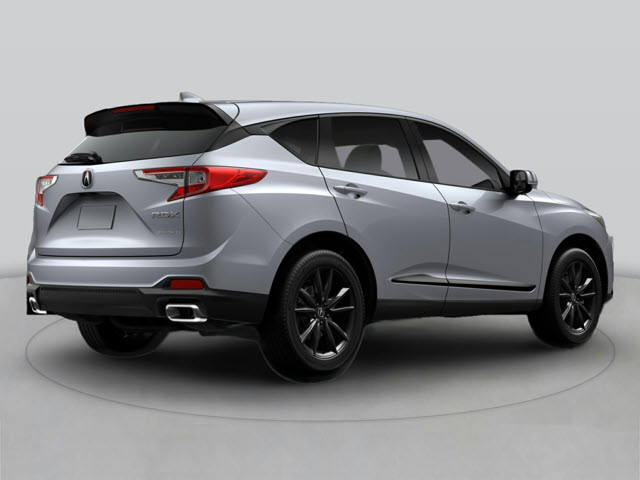 A silver 2026 Acura RDX SUV viewed from the rear, with a black roof and wheels.