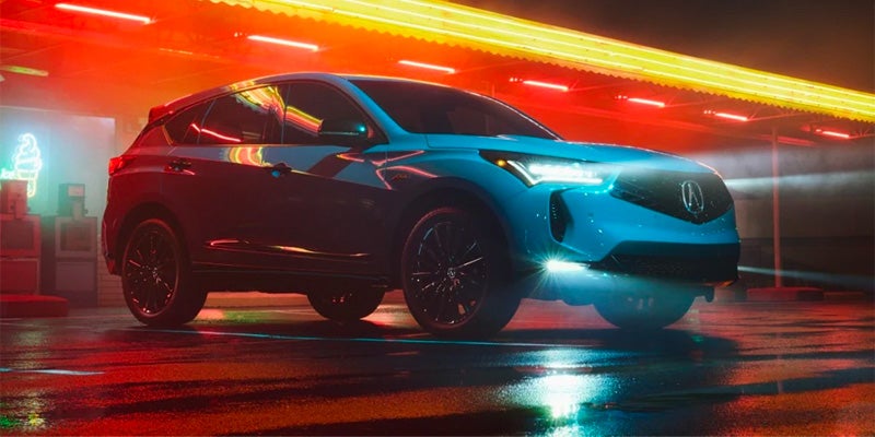 Silver 2025 Acura RDX with neon lights